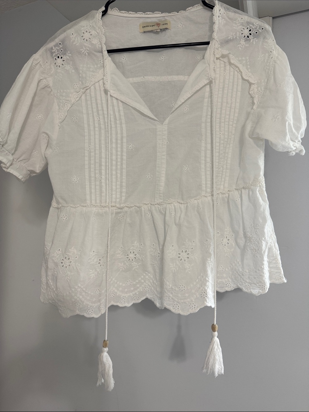 Eyelet Peplum Blouse with Tassel Ties - White